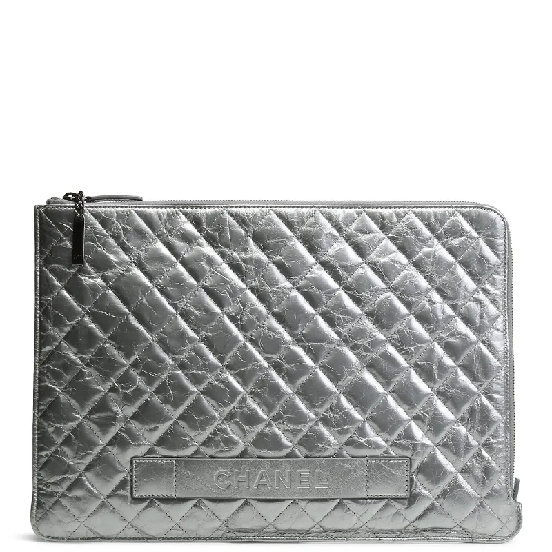 Chanel bags available at online luxury retaileCHANEL Crinkled Quilted Laptop Cover - Silver - OUTLET FINAL SALE