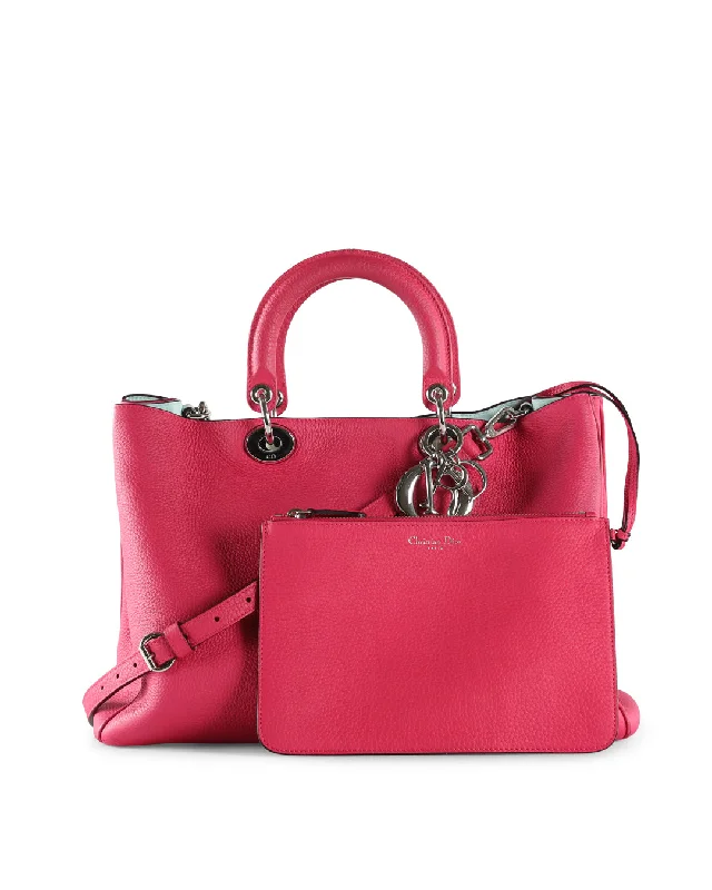 Christian Dior handbags with a snap - button closure and a decorative buckleCHRISTIAN DIOR Fuchsia Pebbled Leather Large Diorissimo Shopper Tote Bag